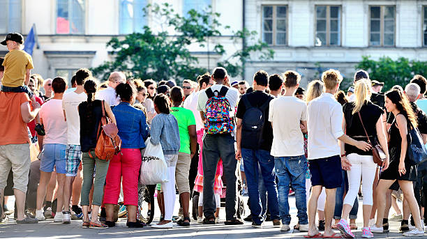 Macro shot of mini business people standing - focus only on the business man in the middle west