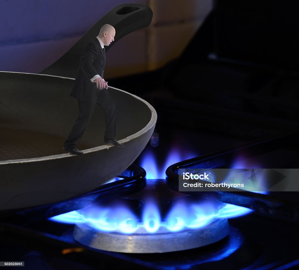 Frying pan into the fire Concept of mistake of jumping from the frying pan into the fire Fire - Natural Phenomenon Stock Photo