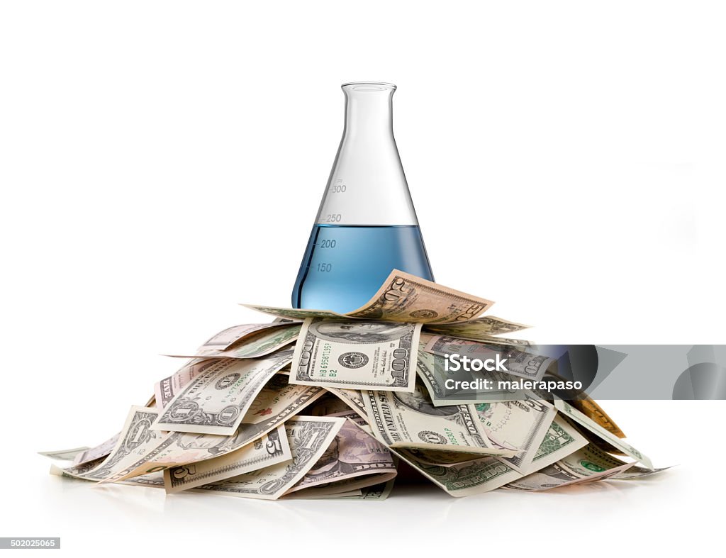 Research investment Erlenmeyer flask on heap of money. Chemistry Stock Photo