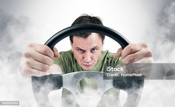 Funny Man With A Steering Wheel In Smoke Stock Photo - Download Image Now - Humor, Speed, Adult