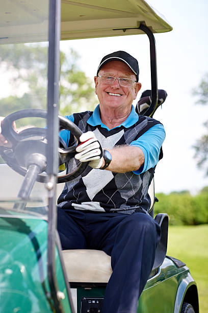 istock Senior golfer sitting in a golf cart 502025243