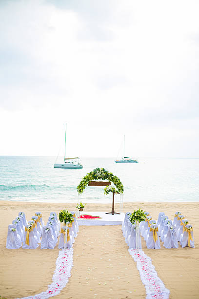 istock wedding arch decorated with flowers on sand beach 502034379