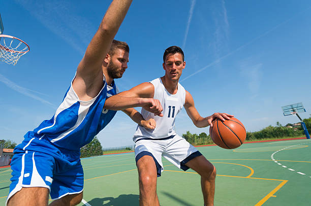 istock Basketball players in dribbling action 502034439