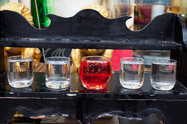 istock Buddhist shrine with glasses and water 502035021