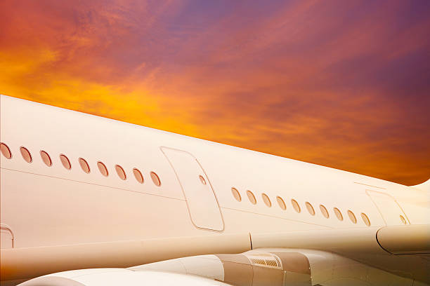 istock Jet airplane windows from outside, door, wing, white fuselage 502035065