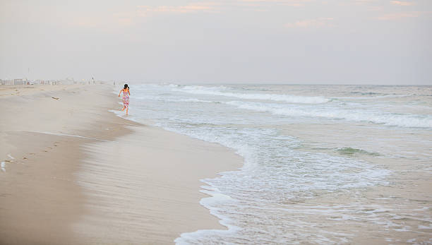 istock Girl running at the beach 502035183