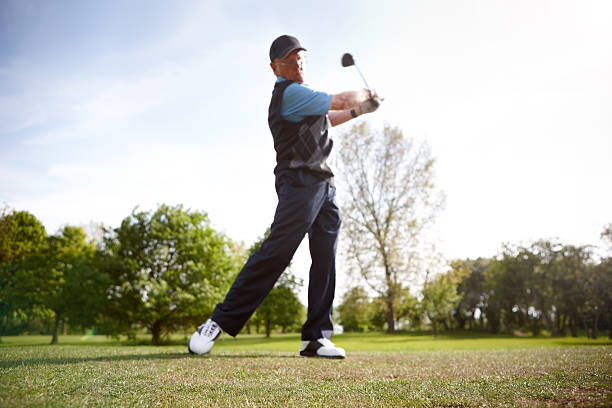 istock Male golfer shooting a golf ball 502035267