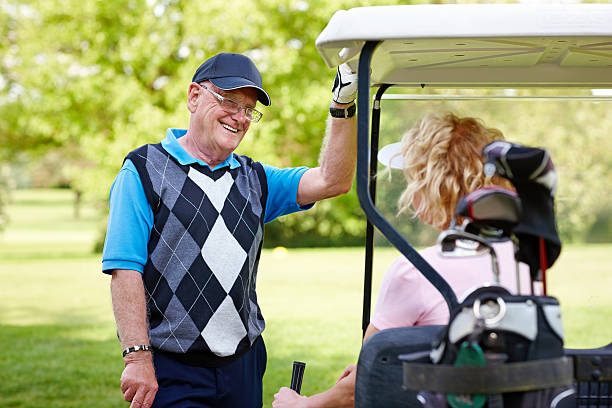 istock Happy mature couple at golf course 502035315