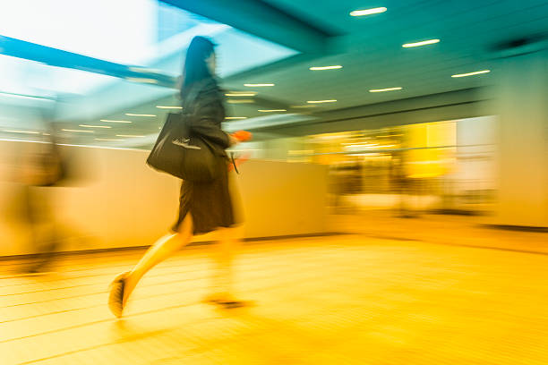 istock People in blurred motion at walkway 502035377