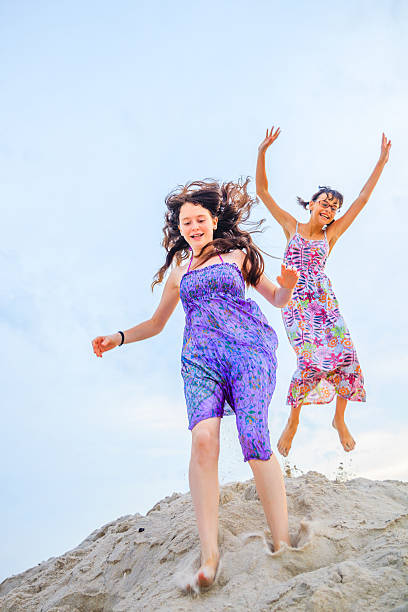 istock Two girls jumping 502035485