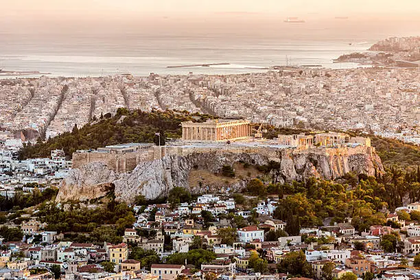 Aerial view over the City of Athens with famous Acropolis at Sunset. Athens, Greece.