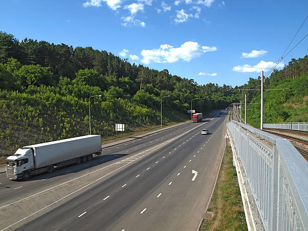 istock Road and tram bridge over the river 502037199