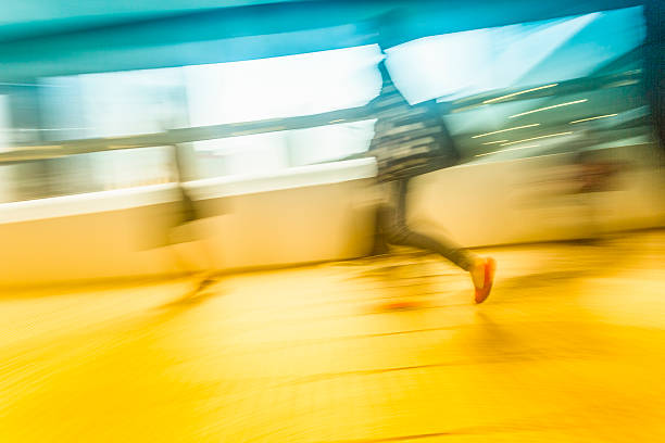 istock People in blurred motion at walkway 502037735