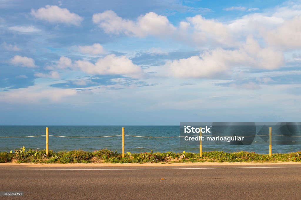 Driving to the Beach Standing across the street from the beach. Backgrounds Stock Photo