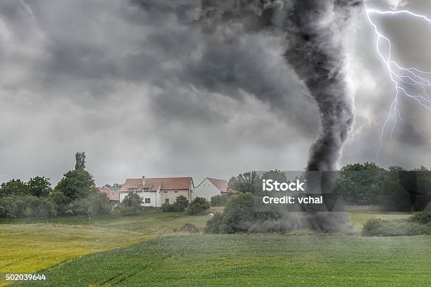 Black Tornado Funnel And Lightning Over Field During Thunderstor Stock Photo - Download Image Now