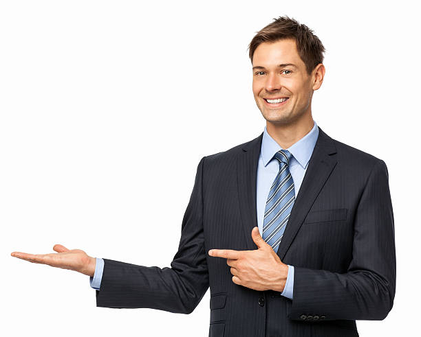 istock Smiling Businessman Pointing At Invisible Product 502040215