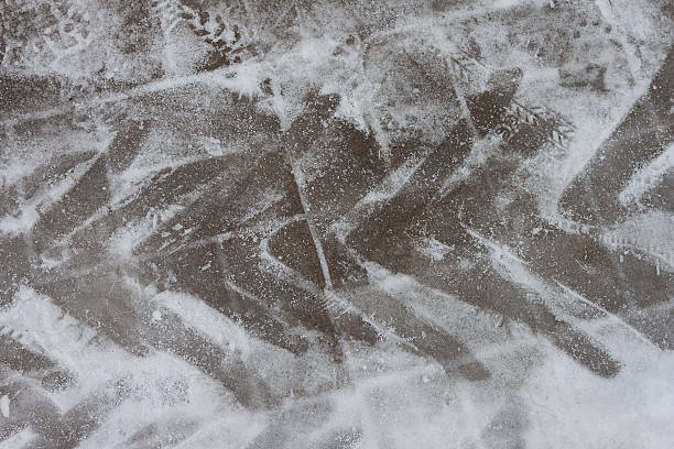 istock Traces of a tractor in street tile 502042688