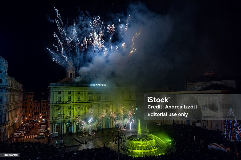 Happy new year and merry xmas fireworks Genoa, Italy - December 19, 2015: Happy new year and merry xmas fireworks in town main place crowded of people Celebration Stock Photo