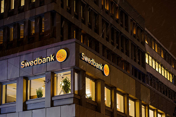 swedbank logo on a snowy night on the building facade - budget sverige bildbanksfoton och bilder