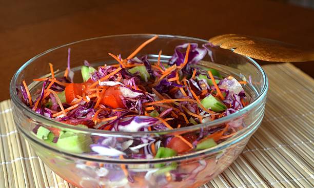 istock Healthy vegetable salad with red cabbageon a glass bowl 502043778