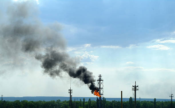 istock Factory with smoke on blue sky 502044424