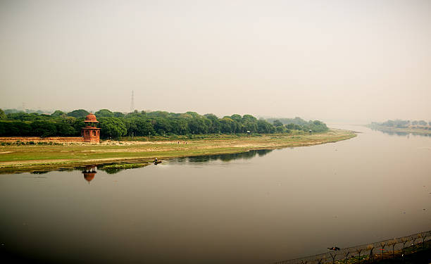 istock Yamuna river and a man in boat. View from Taj 502044720