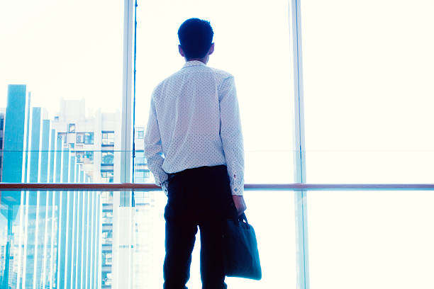 istock Businessman looking out of the window 502046982