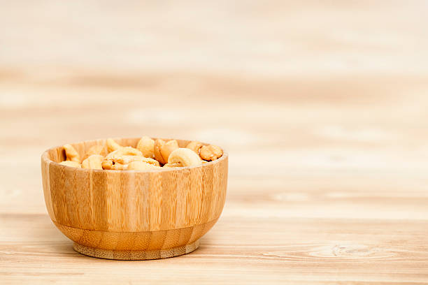 istock Roasted cashew nuts in wooden bowl 502047212