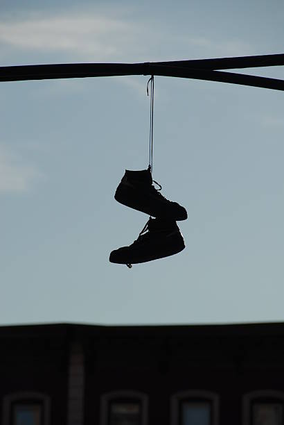 istock Hanging pair of shoes on a wire 502048934
