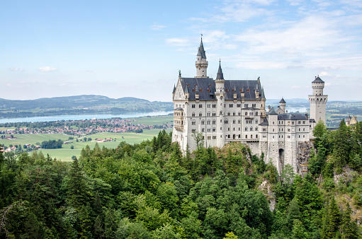 Bavaria, Germany - August 2, 2015: Neuschwanstein Castle, Bavaria, Germany. Neuschwanstein Castle in the Bavarian Alps of Germany. The castle was commissioned by Ludwig II and completed in 1892.