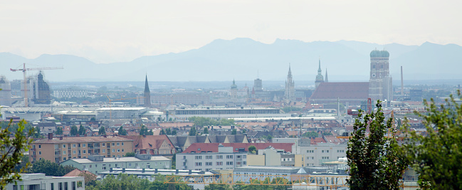 Salzburg, Austria - May 11, 2022: View of the old town and the Hohensalzburg Fortress, with the Salzach river in the foreground.