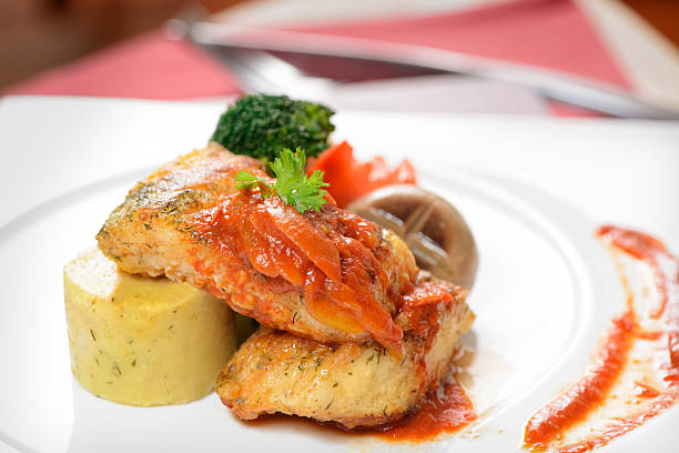 istock fish steak with vegetables are ready to server 502050414