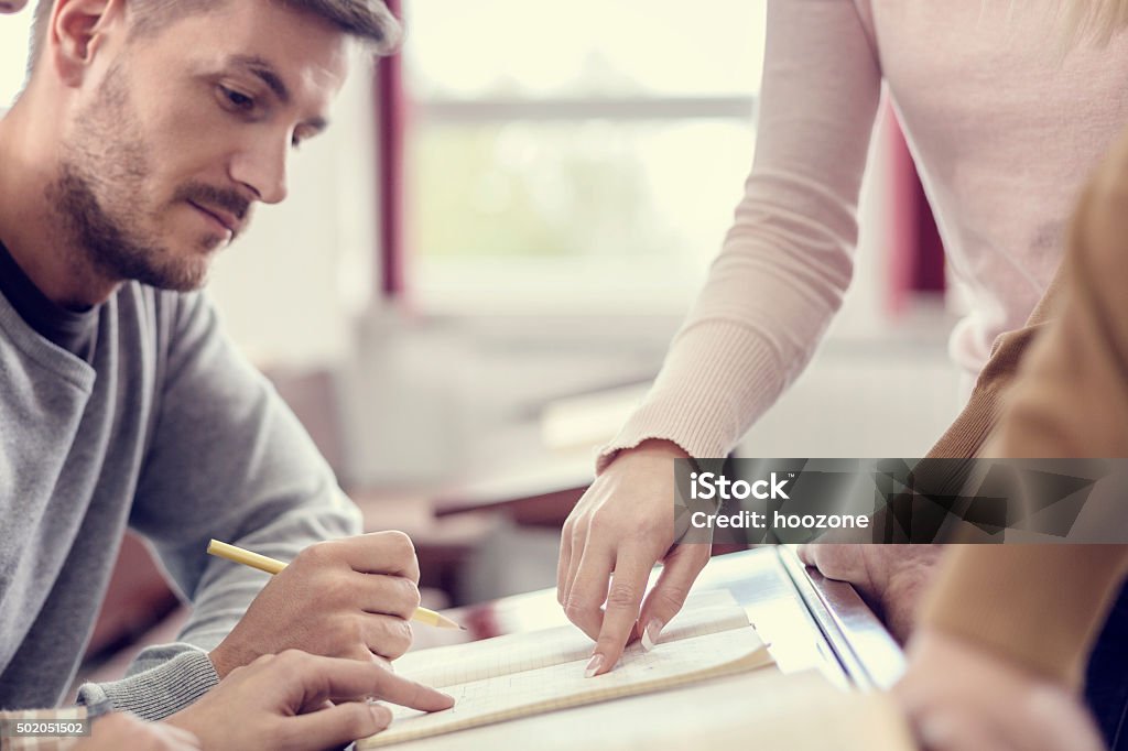Student Ssolving Problem College Students Solving Problem Stock Photo - Download Image Now - 20 ...