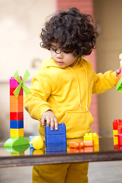istock Little boy playing with toys 502051792