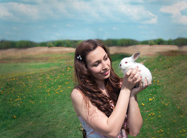 istock girl holding a white rabbit 502057993