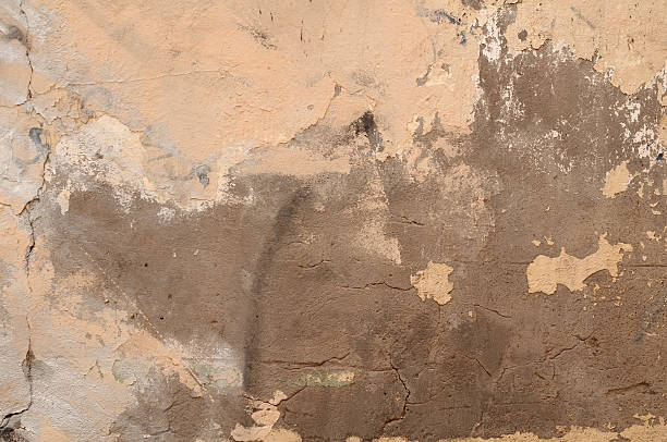 istock Texture of old yellow plastered walls 502058447