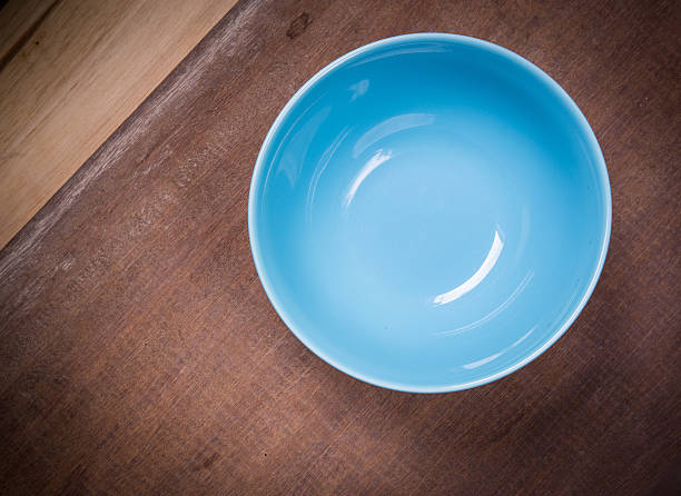 istock Round plate with blue on wood table 502060947