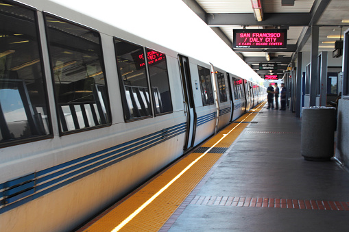 BART, the popular Bay Area Rapid Transit, metro train at a train station. The train has handicap access.