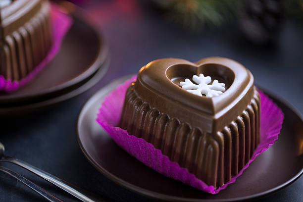 Chocolate Heart Cake with White Snowflake for New Year's Eve stock photo