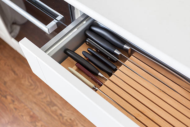 istock Six kitchen knifes in brown wooden table 502070888