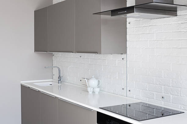 istock White new modern kitchen with counter top and exhaust hood 502070964