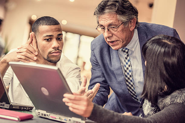 istock Senior man explaining strategy to his younger colleagues 502071628