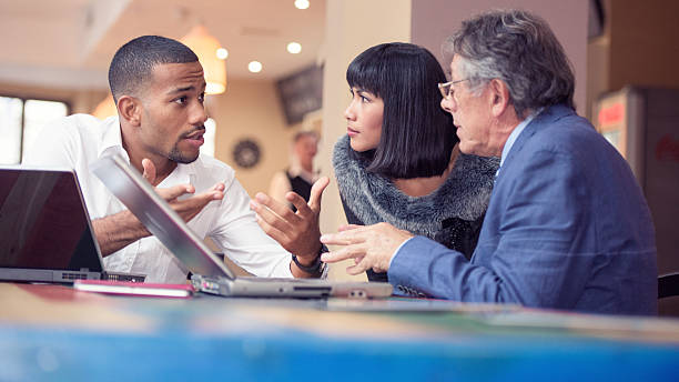 istock Young man explaining his business plans to his colleagues 502072194