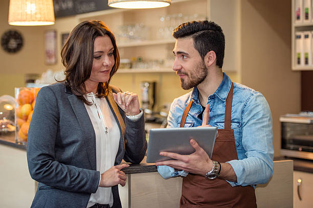 istock Barista and female owner checking new menu 502072756
