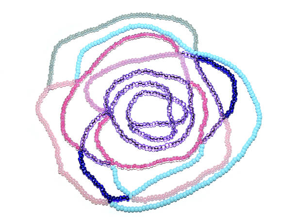 istock Abstract rose of pink, blue and silver beads on white 502073352