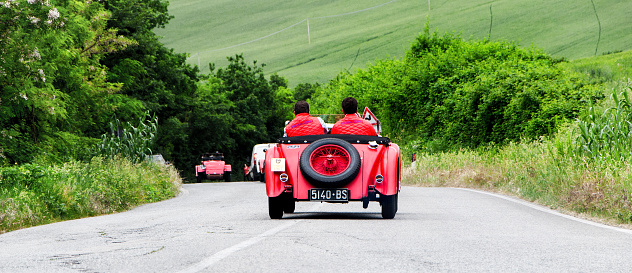 Pesaro, Italy - May 15, 2015: O.M. 665 SS MM 1929 in nidentified crew on an old racing car in rally Mille Miglia 2015 the famous italian historical race (1927-1957)