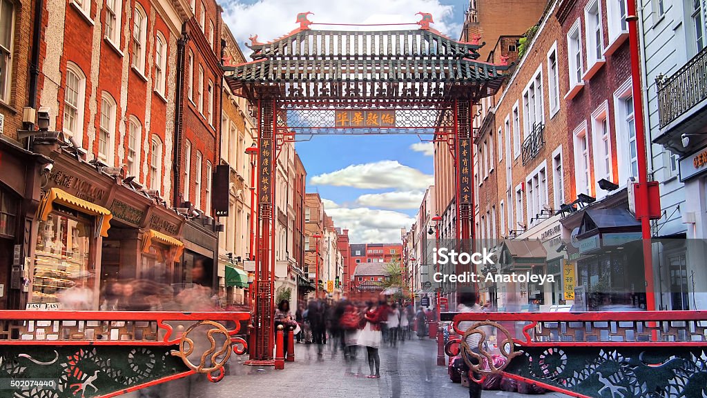 Daytime long exposure in China Town Long exposure taken in the afternoon of tourists on Gerrard's Street, China Town. London - England Stock Photo