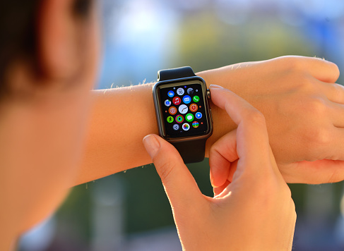 İstanbul, Turkey - August 16, 2015: Woman using Apple Watch Sport. Apple Watch is a smart watch, developed by Apple Inc.