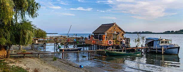 istock Old man preparing his boat for sailing. 502075996