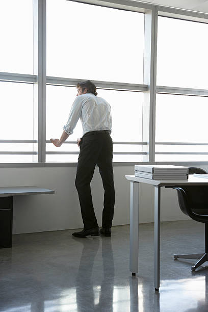 istock Businessman Looking Out Of Office Window 502086479